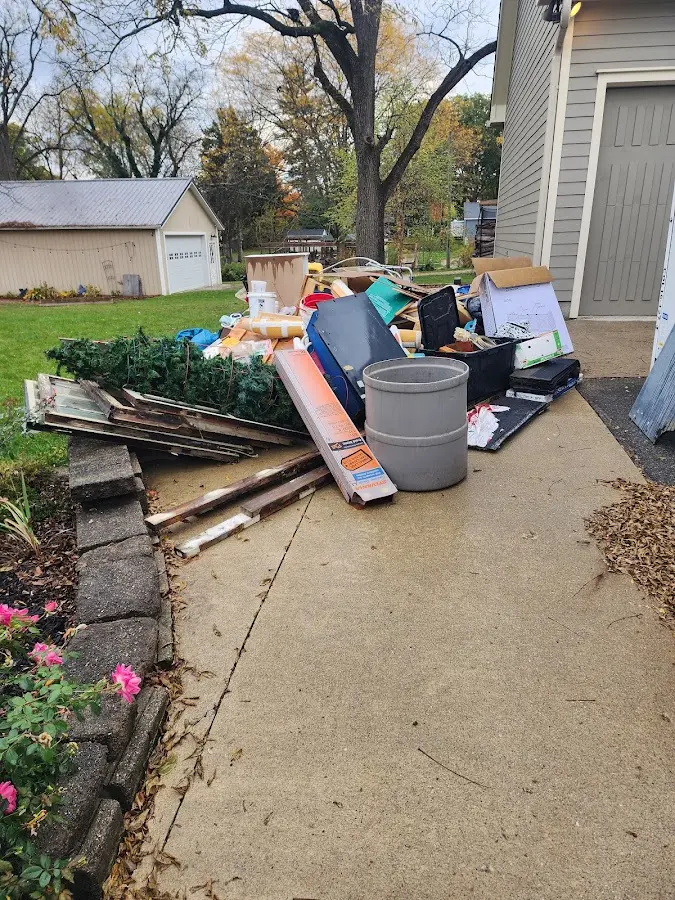 Dumpster being loaded with debris for Estate Cleanout Dumpster Rental in Colesville